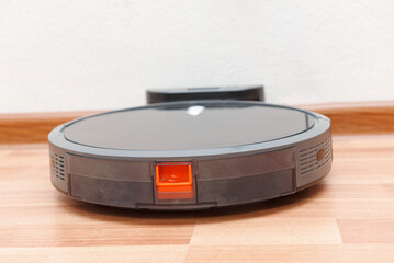 Robot vacuum cleaner go to charging dock after it is finished. Robotic Vacuum