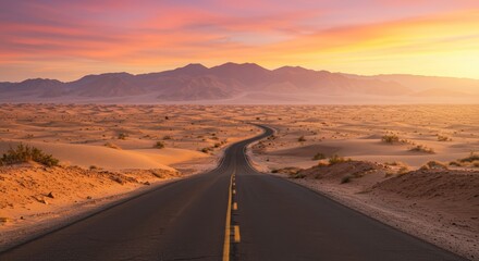 Scenic desert landscape with a winding road leading towards distant mountains under a colorful sky at sunset