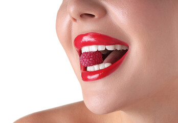 Naklejka premium Woman with beautiful red lipstick on her lips and raspberry candy against white background, closeup