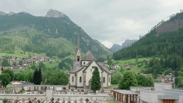Alpine Village Nestled Among Dolomite Mountains, Historic San Vigilio Church in Moena Valley, Italy