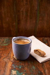 Cup of coffee on rustic wooden background. Soft focus. Copy space	