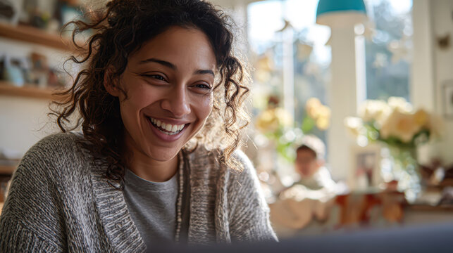 A young Black woman coding on a laptop with a bright smile while sitting at an outdoor cafe