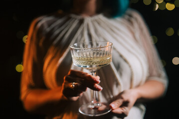 Woman With Champagne In Retro Styled Glass Goblet. Wedding Party Celebration.