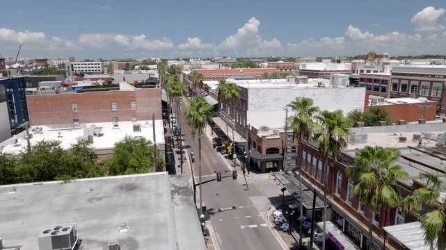 Ybor City neighborhood in Tampa, Florida with drone video moving up wide shot.