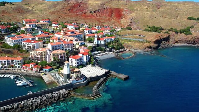 Ponta de Sao Lourenco Aerial Drone Video with Canical Village and marina. Madeira Island Portugal. Dramatic Volcanic Cape Landscape and Atlantic Ocean Cliffs 4K Travel Destination Scenery