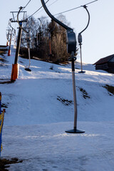 Empty Platter Ski Lift on Snowy Slope at Sunset