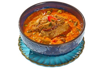Authentic Thai Red Curry with Roasted Duck (Gaeng Phed Ped Yang) in a Dark Blue Bowl