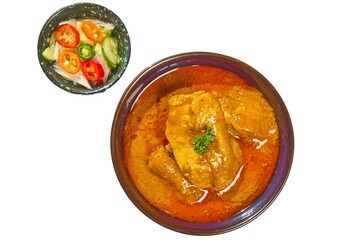 Traditional Thai Massaman Chicken Curry (Gaeng Massaman Gai) with Cucumber Relish (A-Jad), Isolated