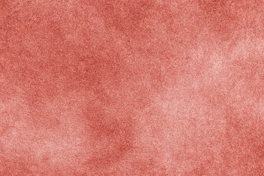 Textured red velvet fabric surface with soft plush appearance
