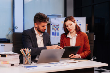 Project manager working overtime and update tasks with milestones progress planning and professional investor working new start up project in the office.