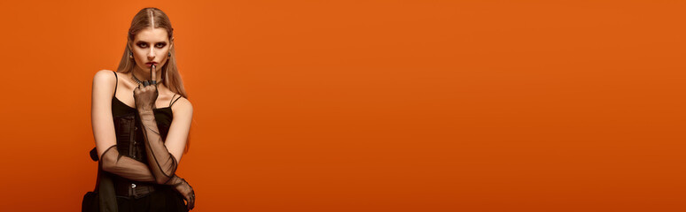 A striking young woman showcases her Halloween costume, evoking a spooky vibe for the season