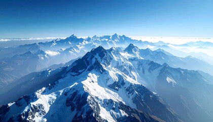 Majestic snow-capped mountains pierce through soft clouds under a clear, serene blue sky, evoking awe and adventure