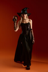 Enchanting Halloween witch costume with a spooky vibe at night