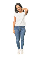 Obraz premium Full body shot of Latina in studio suffering neck pain due to sedentary lifestyle.