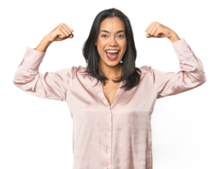 Simple portrait of a young Latina showing strength gesture with arms, symbol of feminine power