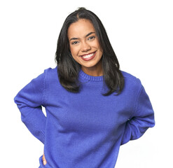 Simple portrait of a young Latina happy, smiling and cheerful.