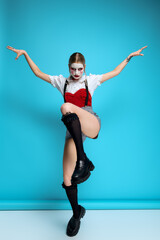 Obraz premium Beautiful young woman showcases Halloween costume with creative flair and spooky charm