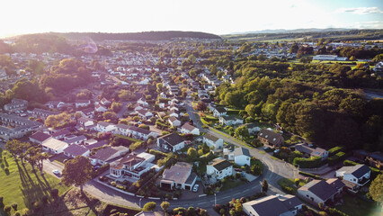 Aerial photo showcasing the entire residential area and townscape of Dalgety Bay, Fife, Scotland. High-angle view perfect for depicting coastal town planning and suburban life.