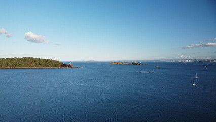Wide panoramic view of the Firth of Forth, featuring Inchcolm Island and its famous Abbey. Captured from the scenic coastline of Dalgety Bay, Fife, Scotland.