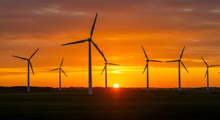 Obraz premium Wind turbines at sunset