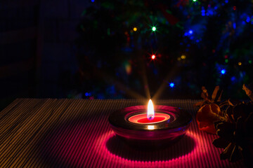 purple candle and Christmas lights