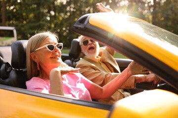 Senior couple enjoying cabriolet ride in city, selective focus © New Africa