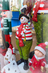 snowman in red scarf at the christmas market