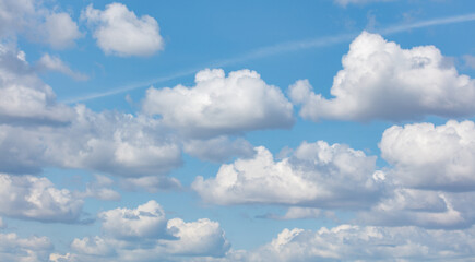 A blue sky with many clouds