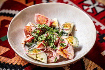 Georgian salad with yogurt dressing and herbs