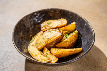 Golden potato wedges with dill