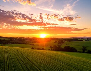Panoramic sunset over rolling green fields