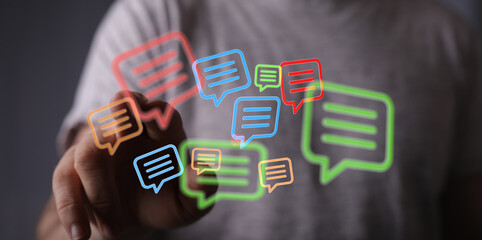 Conceptual image of person touching social media notification icons. Symbolizes messaging, communication and interactions on networks