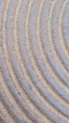 Abstract Patterns in Textured Surface with Circular Lines creating a visually intriguing design