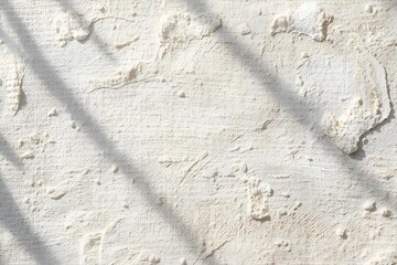 Pure white gypsum wall surface with natural lines and shadows