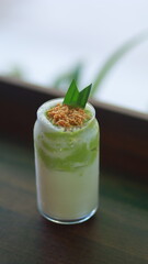 glass of old avocado and young coconut