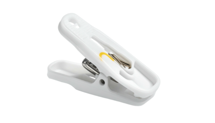 A close-up of a white plastic clip with a yellow accent and metal spring