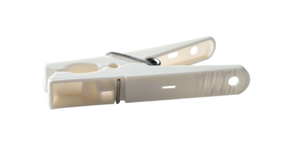 A close-up studio shot of a single, plastic laundry clip against a black backdrop