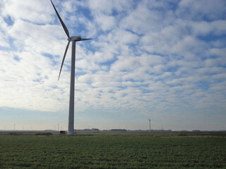 Wind turbine in the wind. Nature backdrop. Beautiful natural flyer, card design. Nature Template for presentation or product