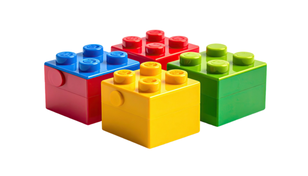 Four colorful plastic construction blocks arranged together on a black background