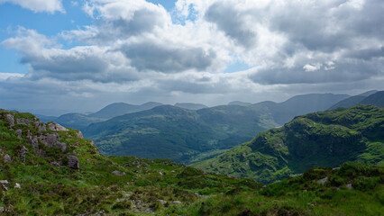 Look out over the green mountains in the Gap of Dunloe, which is in County Kerry, Ireland.