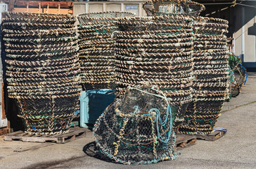 Traditional Creels or Lobster traps or Crab Pots or baskets on the pier in the harbor.