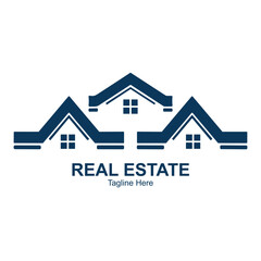 Illustration of three stylized blue house roofs with windows and the text reales tate below