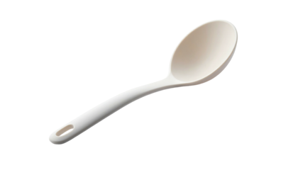 Cream-colored cooking spoon, curved shape, hole in handle, isolated on black backdrop