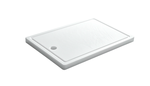 A rectangular white cutting board with a hole on a dark background