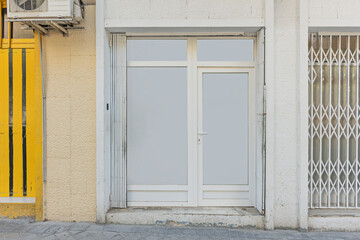 Small bookstore with a glass facade and natural wood frames that invite you to enter