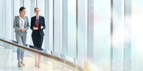 Two businesswomen working together in an office building