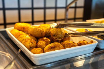 Potatoes baked in their skins in the hotel buffet