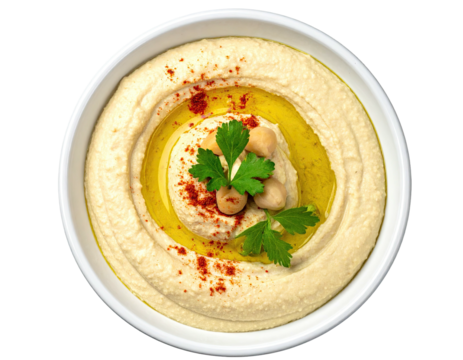 Creamy hummus in a bowl, garnished with chickpeas and parsley
