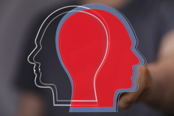 Abstract image depicting two head profiles, one red, one black, symbolizing contrasting viewpoints or perspectives.