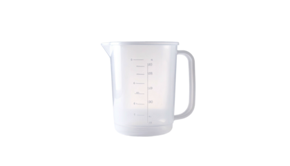 Clear plastic measuring jug with handle and volume markings on a dark background